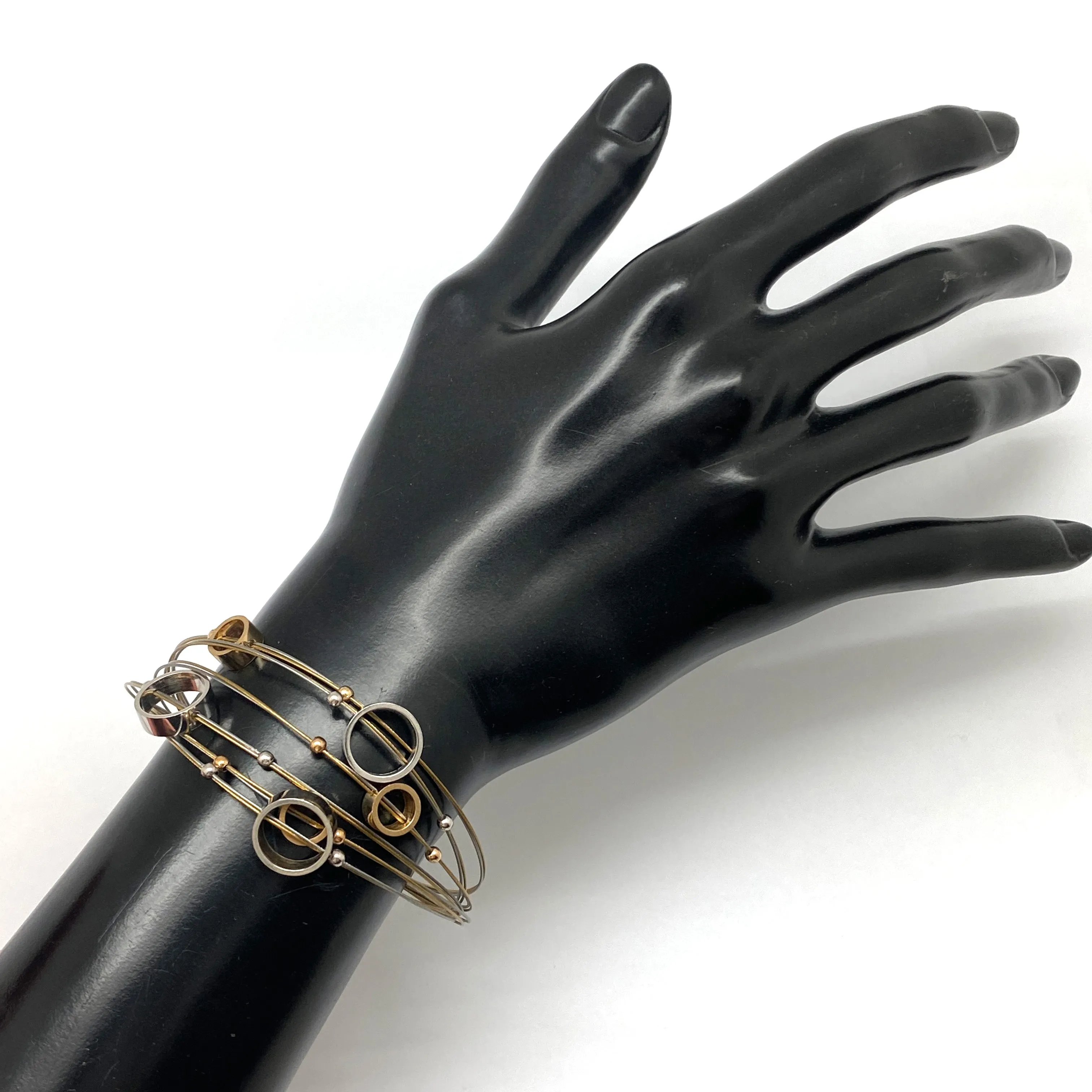 Circular Gold and Silver Steel Cable Bracelet
