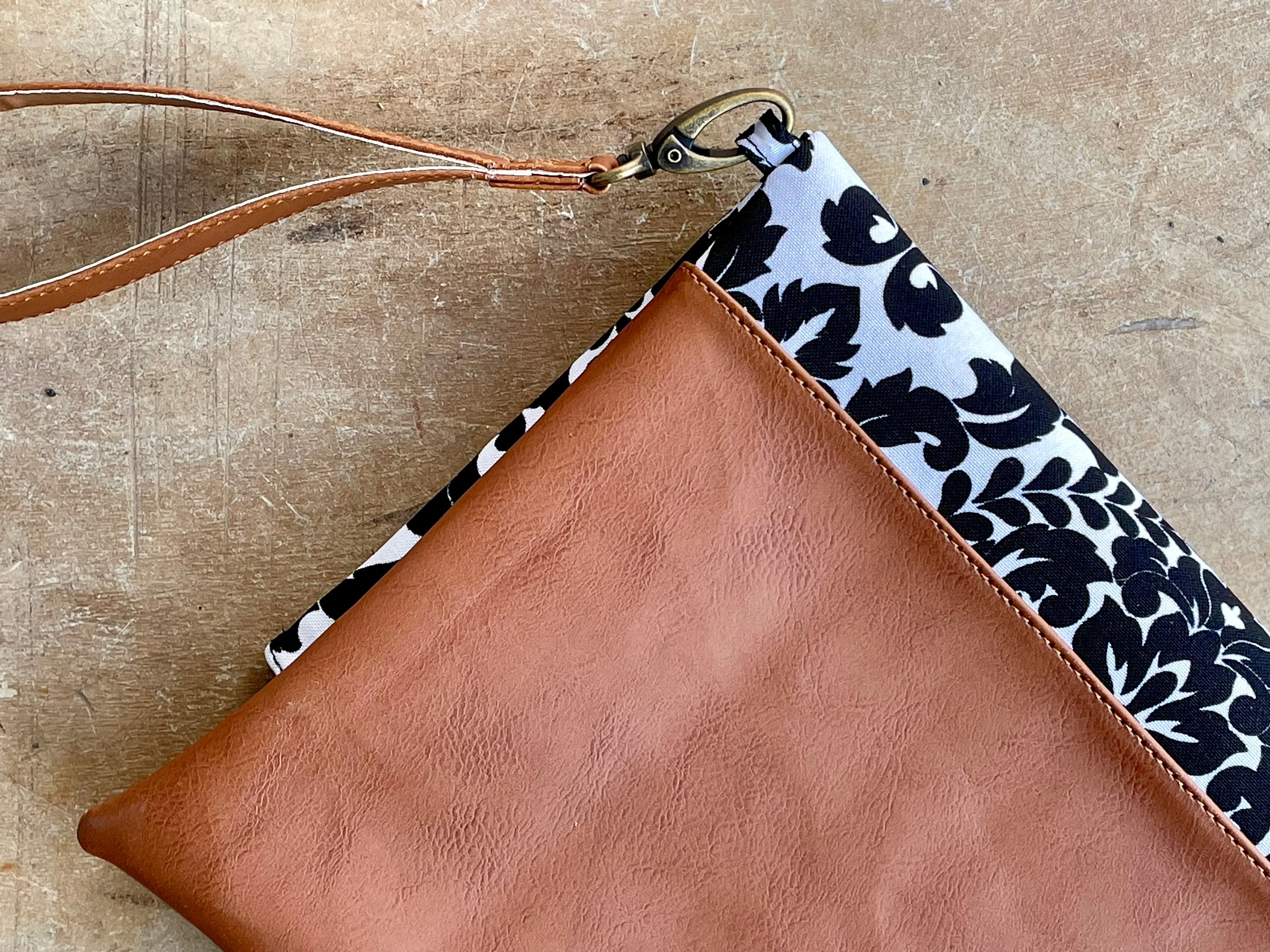 Cross-body foldover clutch