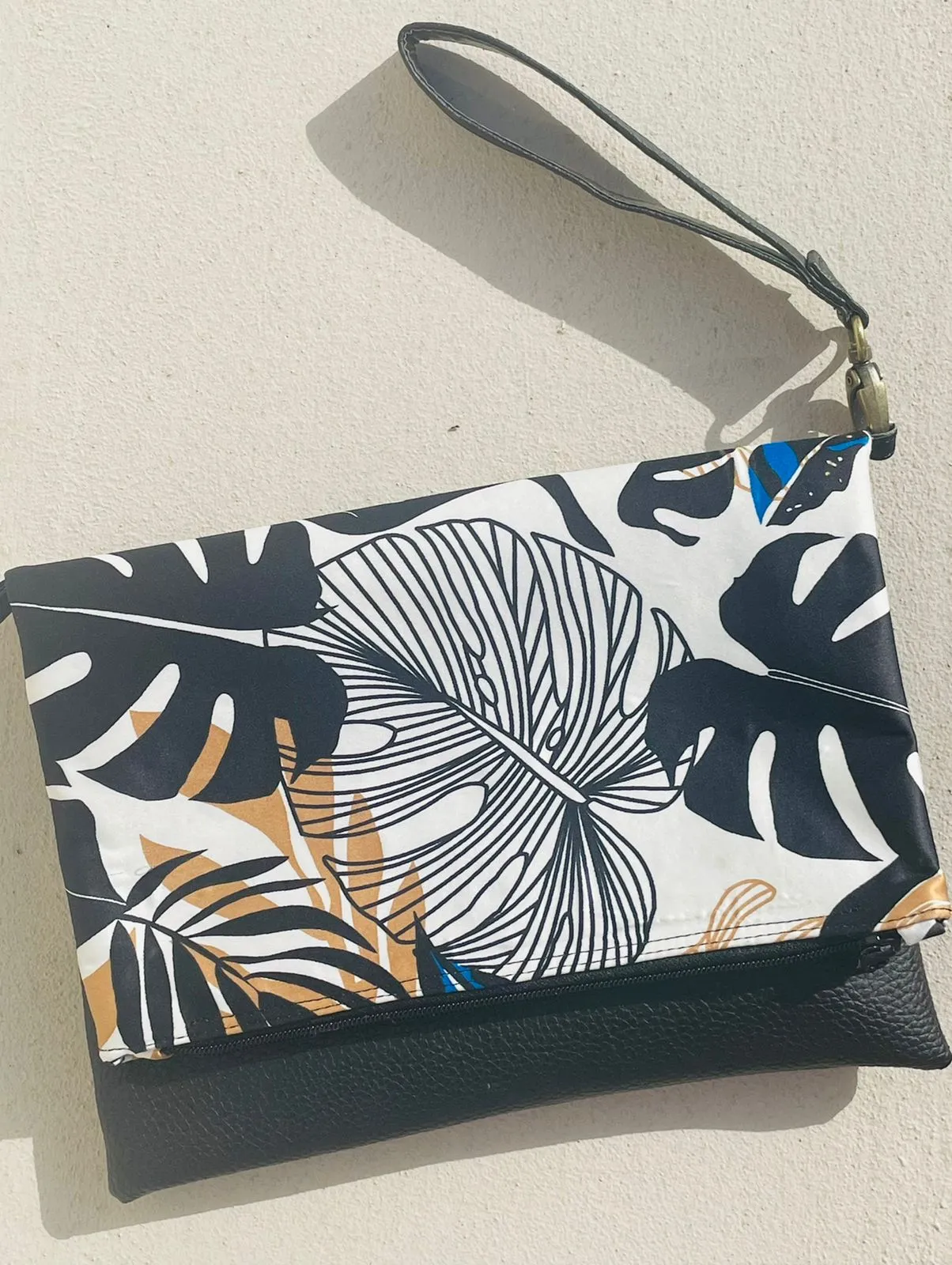 Cross-body foldover clutch