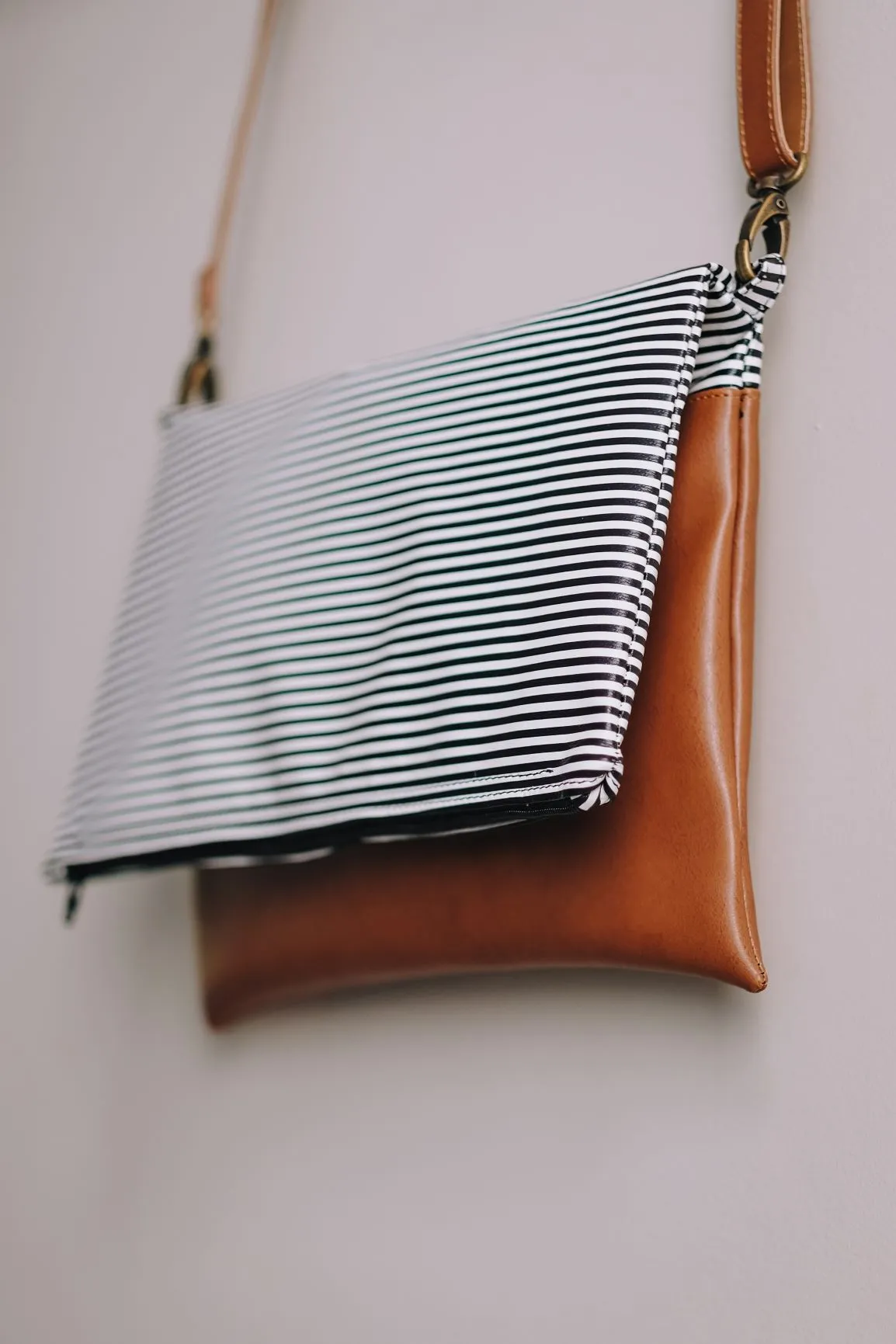 Cross-body foldover clutch