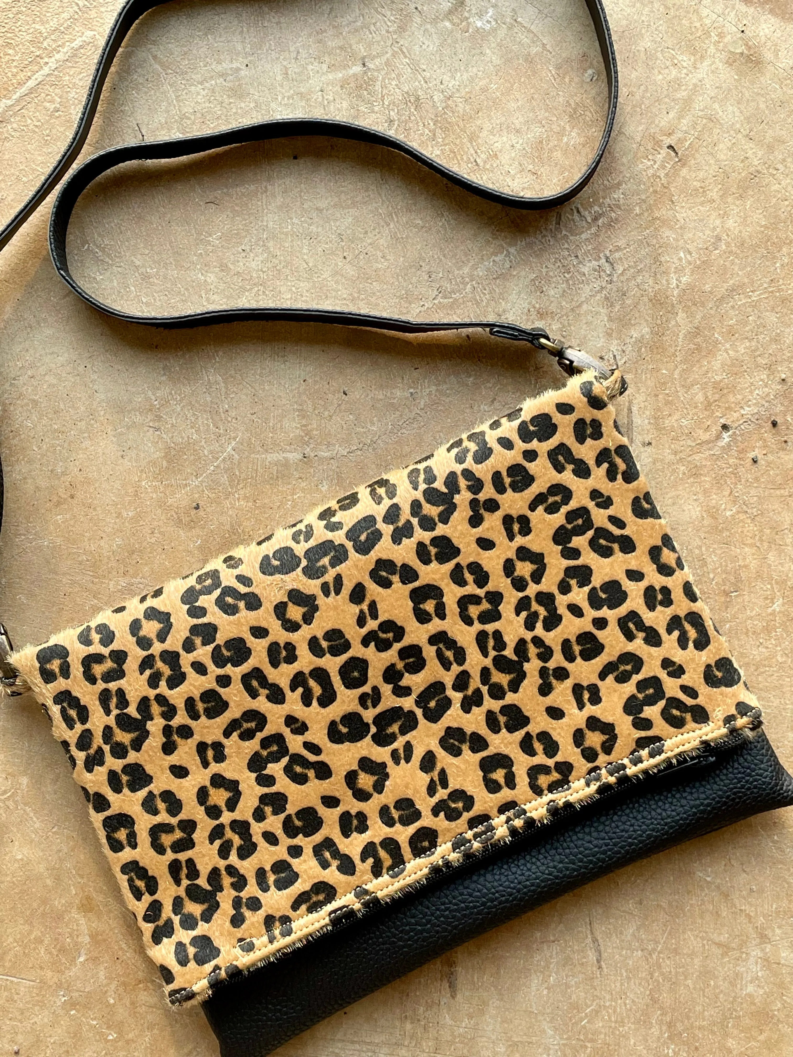 Cross-body foldover clutch