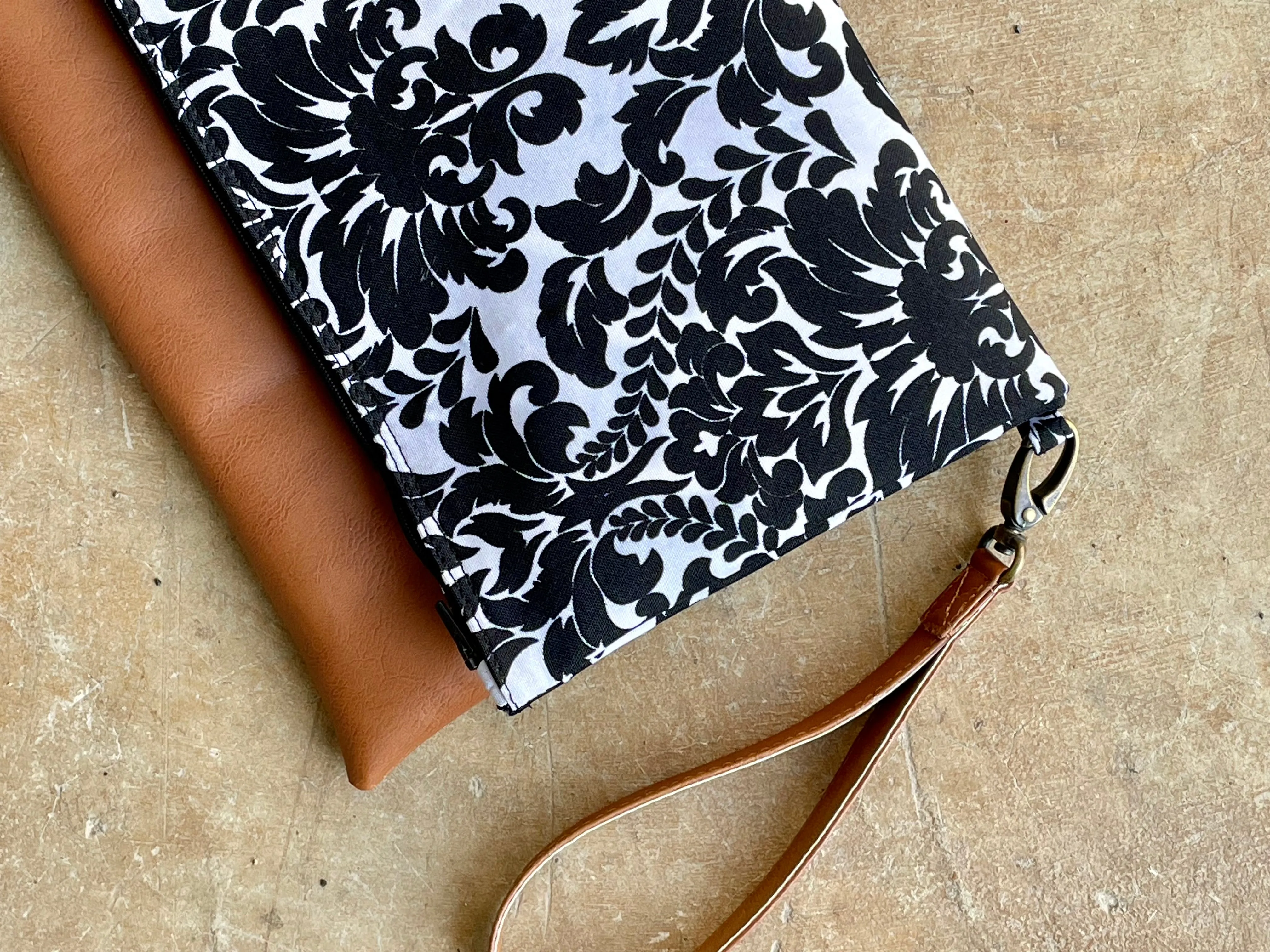 Cross-body foldover clutch