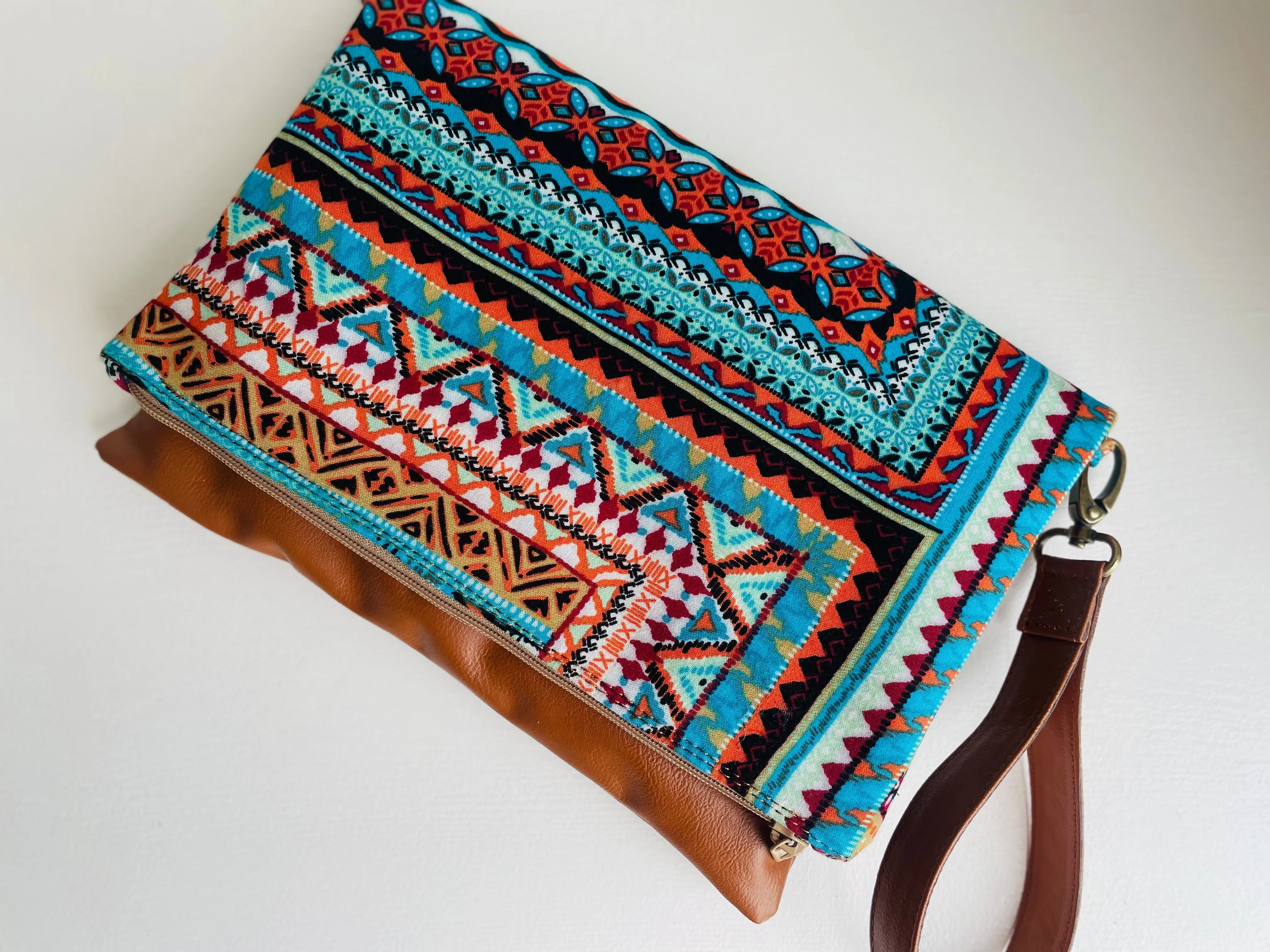 Cross-body foldover clutch