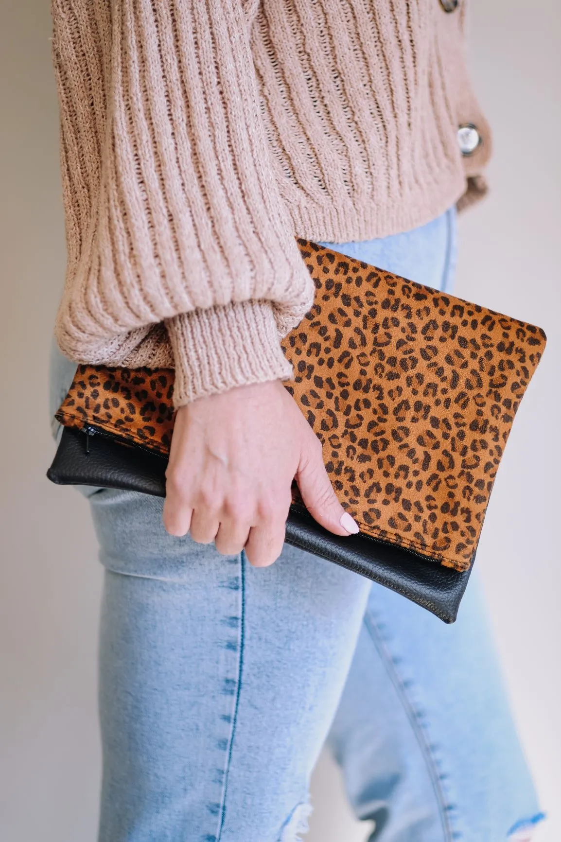 Cross-body foldover clutch